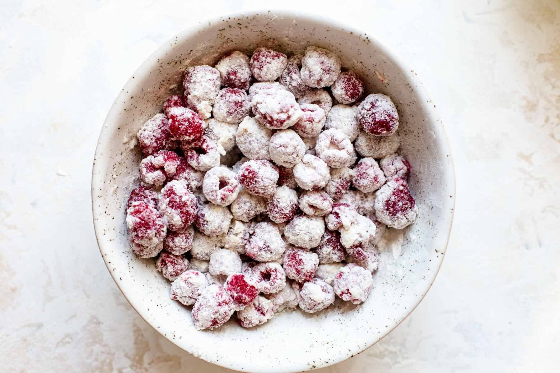 floured raspberries in a bowl