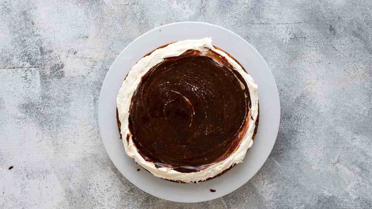 layering toppings on smores cake