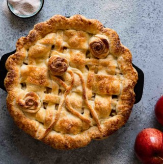 Decorative picture of apple pie sitting on counter
