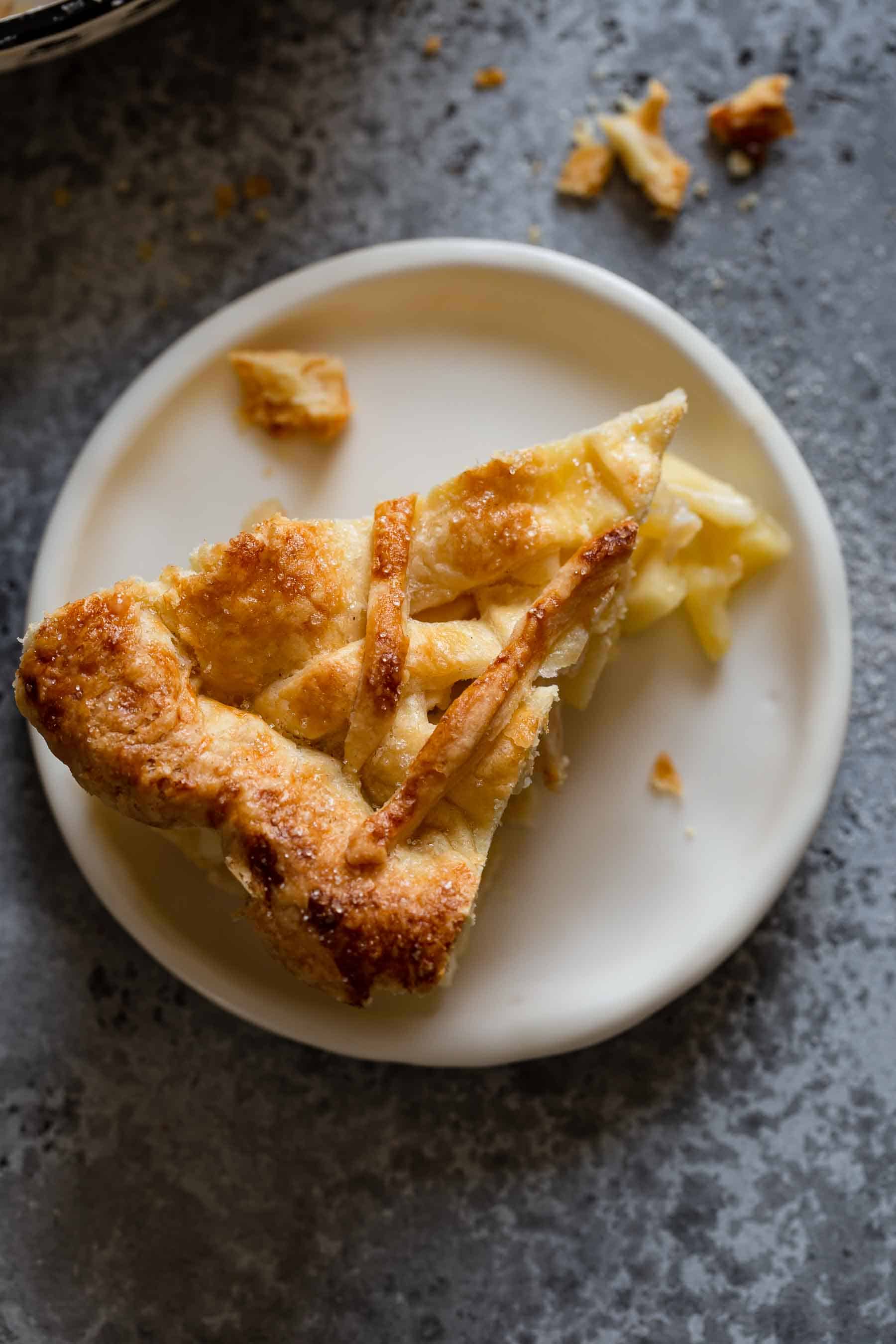 piece of apple pie on a white plate