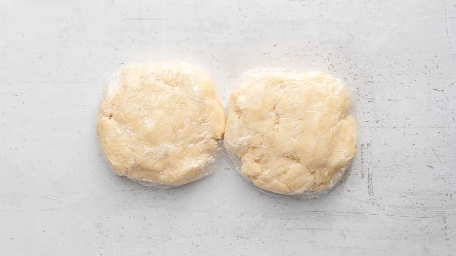 wrapped pie crust balls sitting on counter