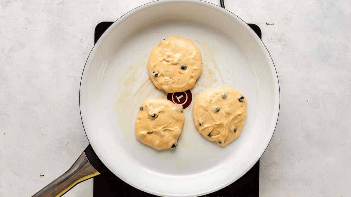 pan with three pancakes in pan
