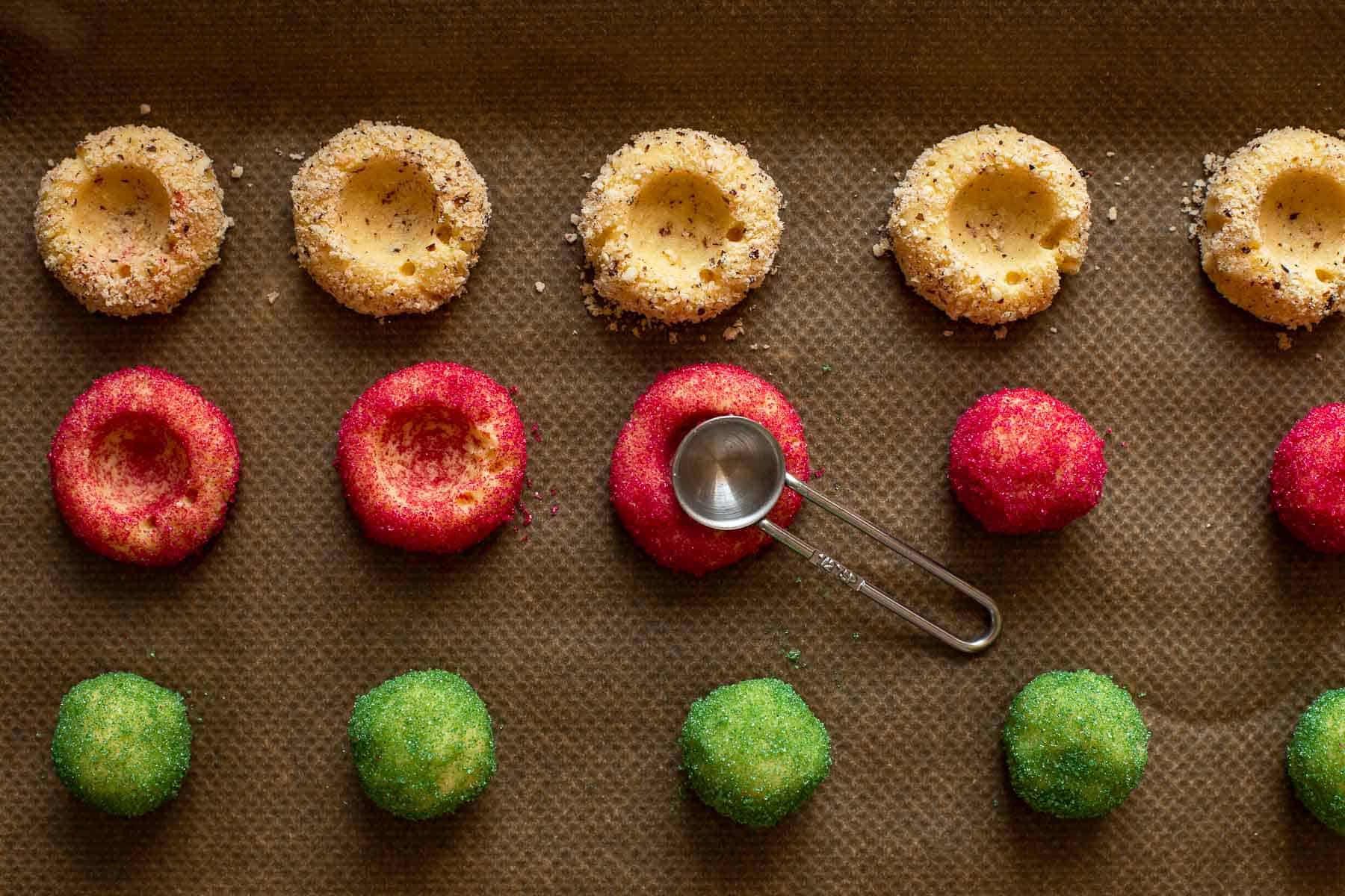 putting holes into thumbprint cookie balls