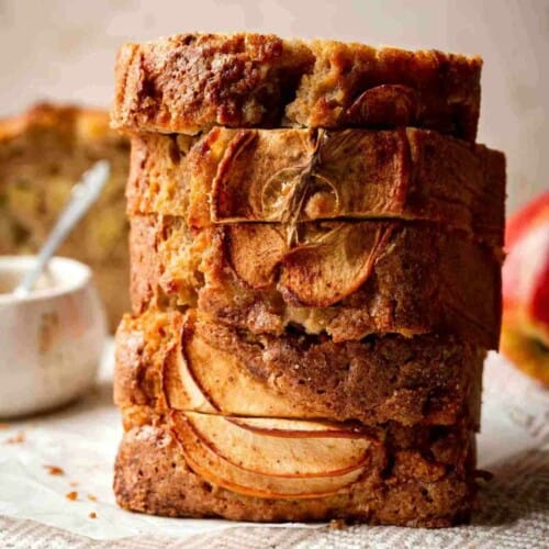 Stacked slices of apple bread on a table