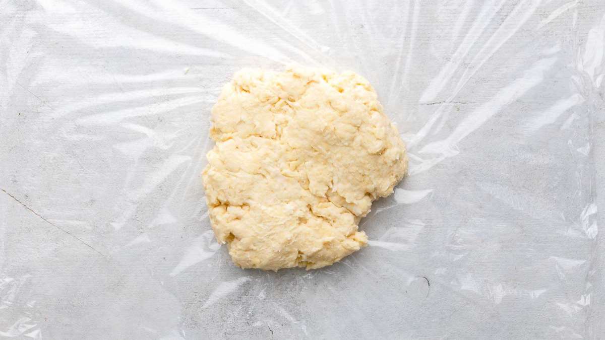 pie crust dough in plastic wrap