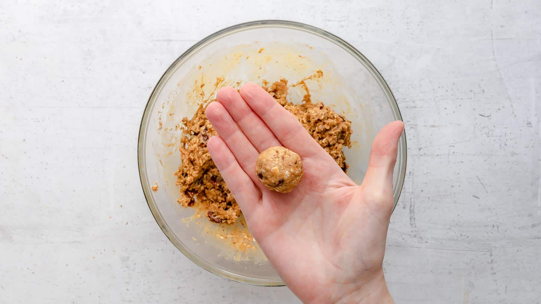 rolling peanut butter bites by hand