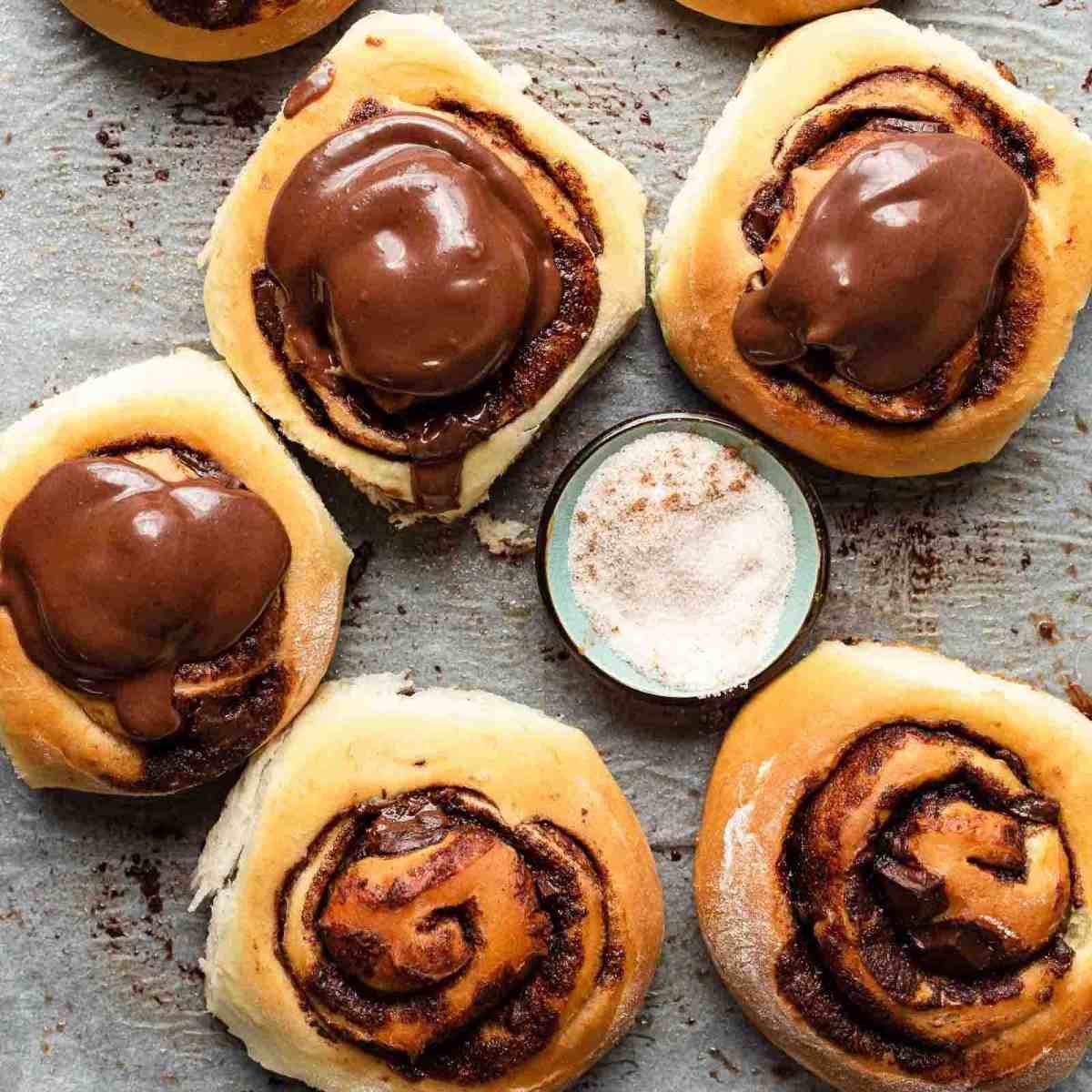 several chocolate rolls on baking pan ready to eat