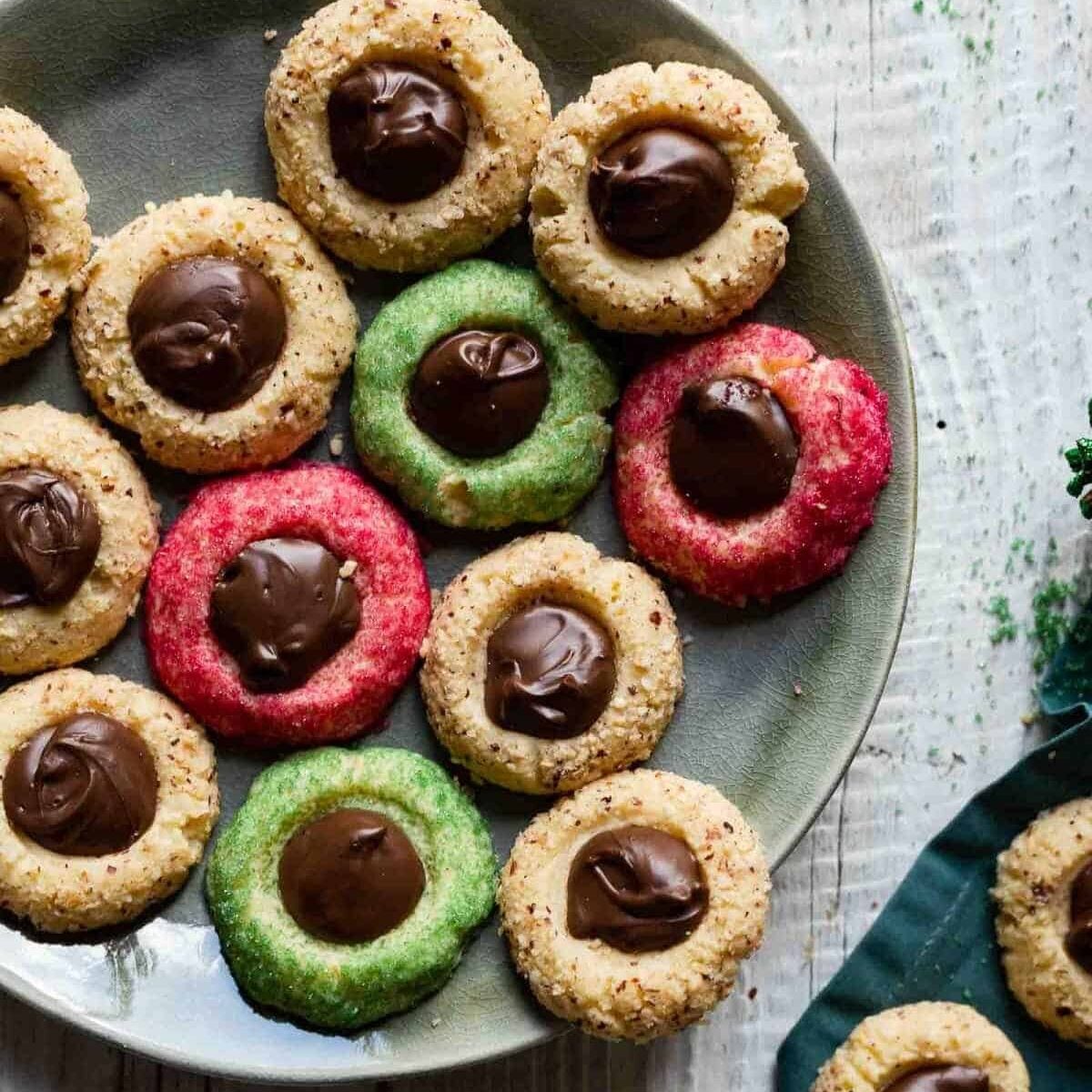 plate of colorful christmas thumbprint cookies