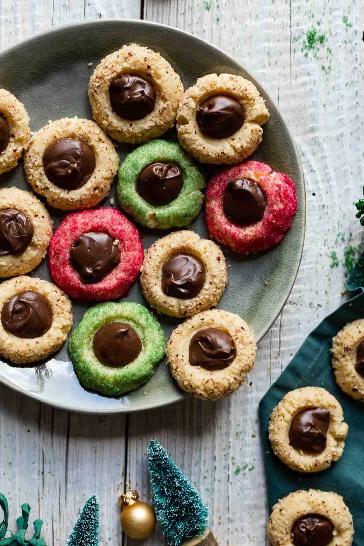 plate of colorful christmas thumbprint cookies