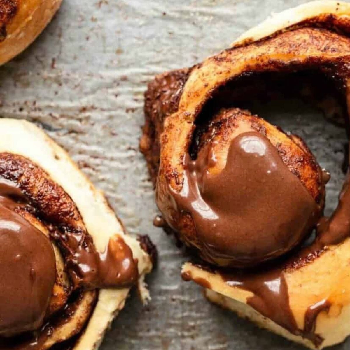 homemade chocolate rolls recipe halfway unrolled with chocolate on top