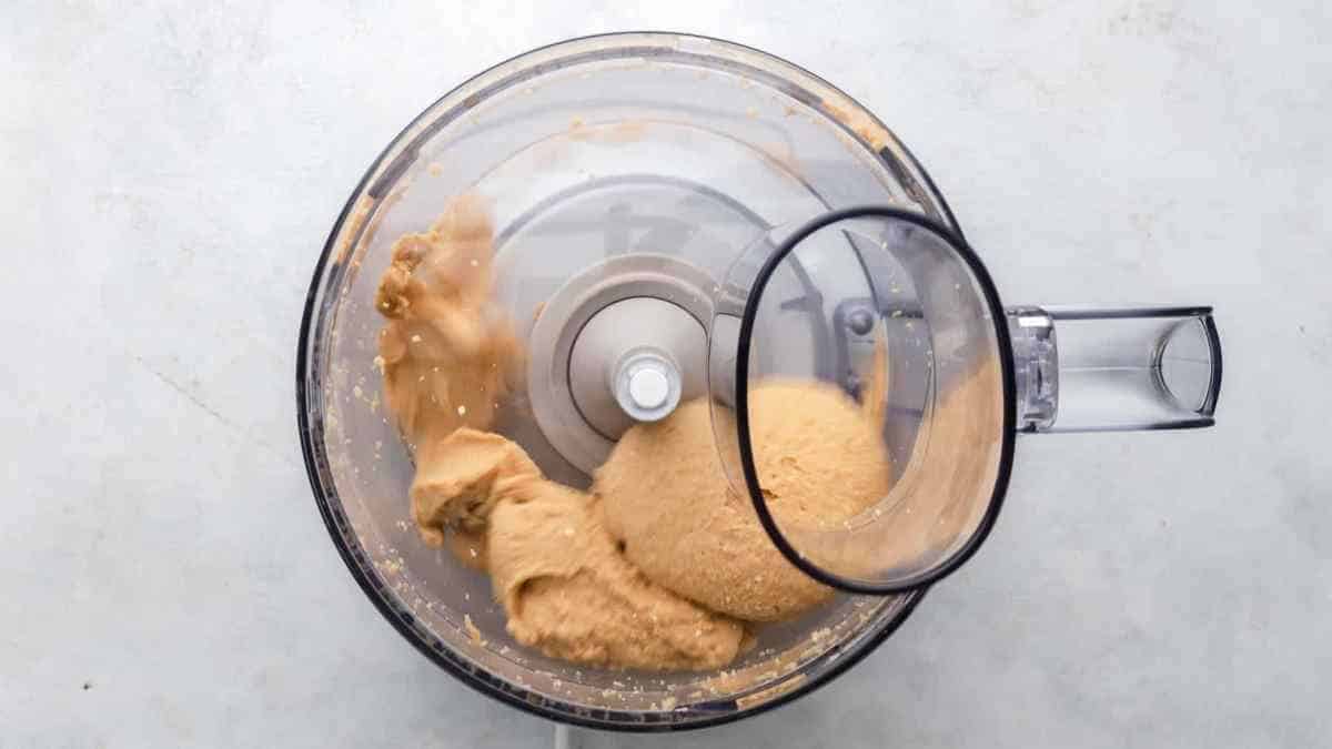 peanuts inside of food processor while it's spinning