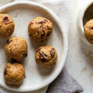 several peanut butter balls on plate ready to eat