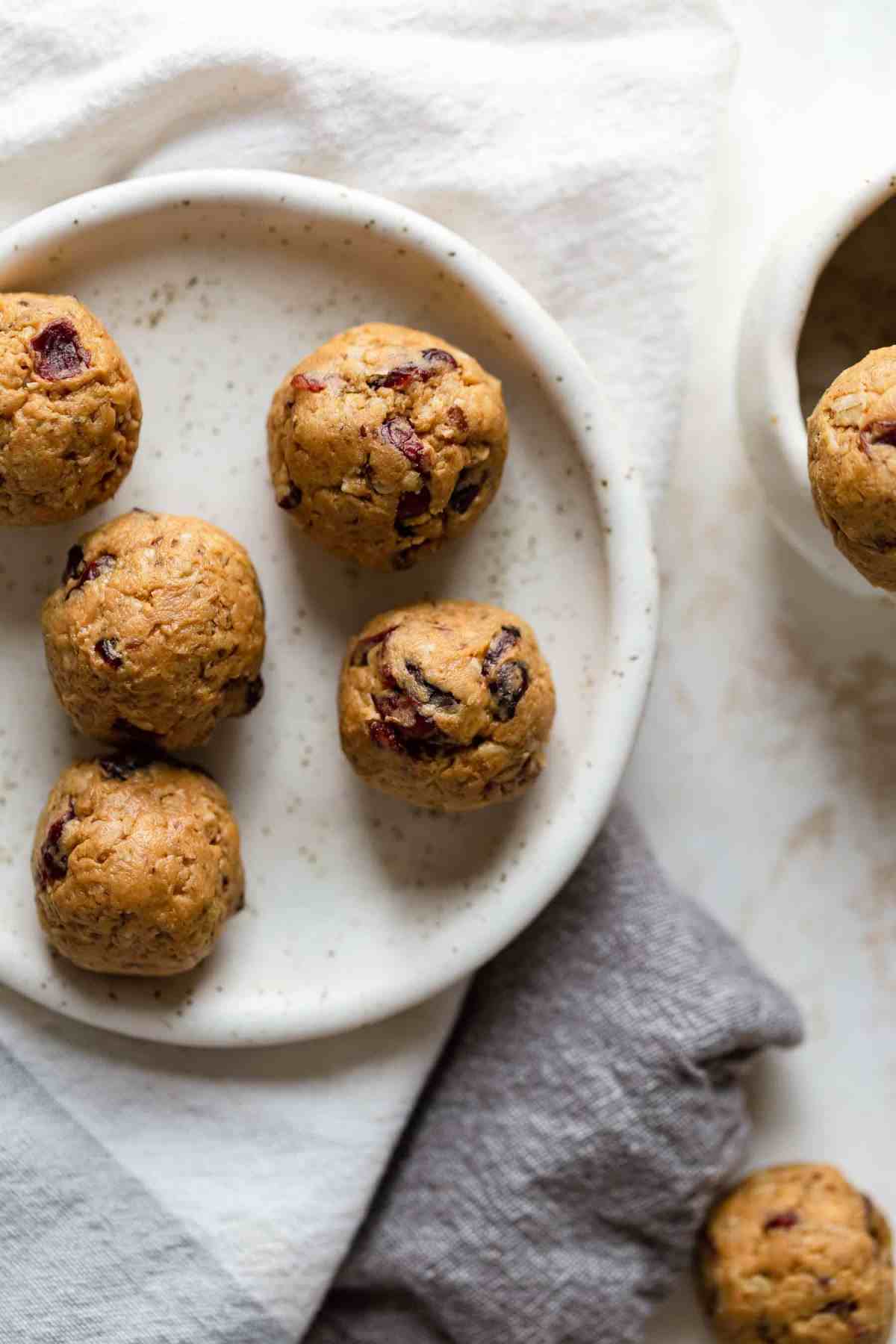 several peanut butter balls on plate ready to eat