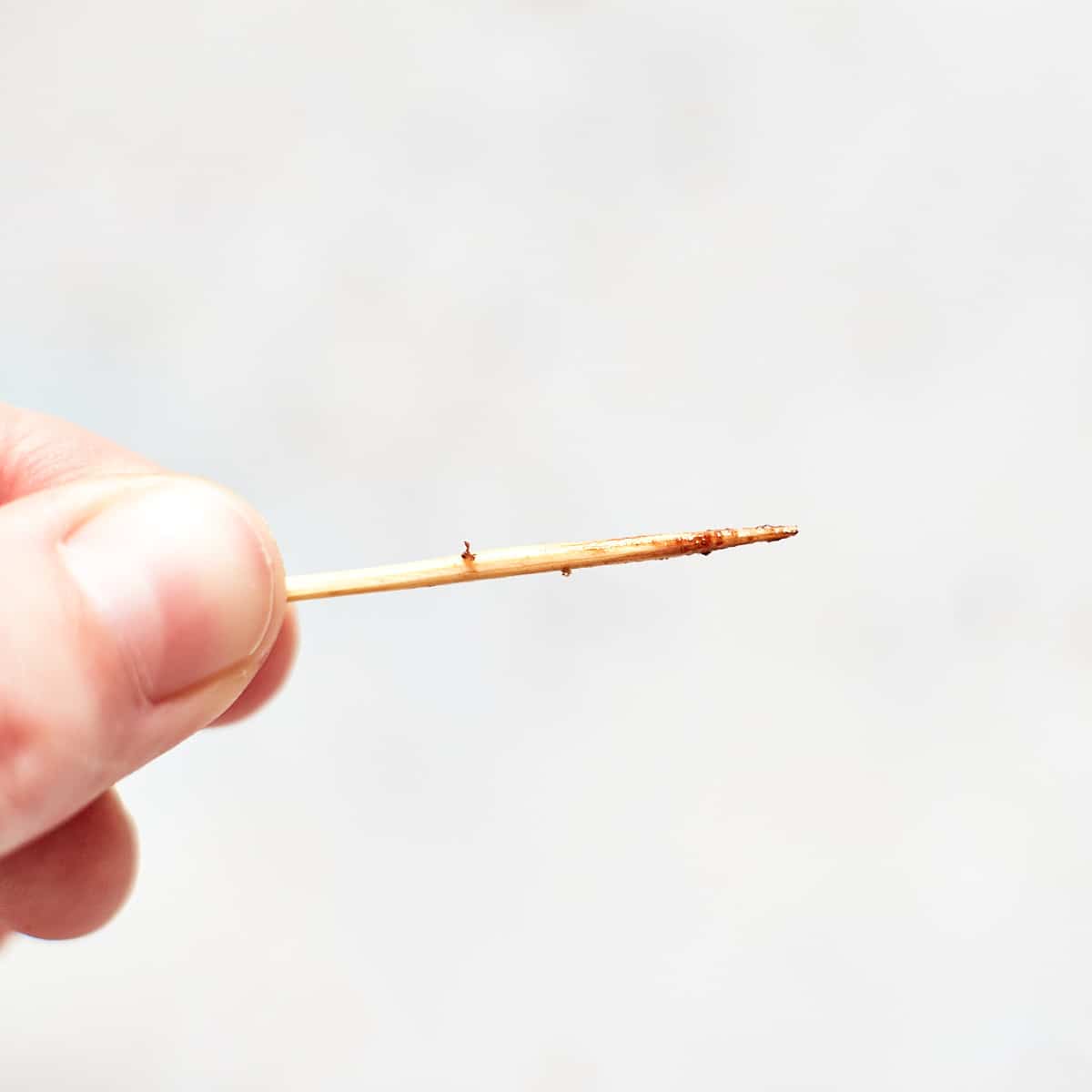 Close up of toothpick after toothpick test to check doneness