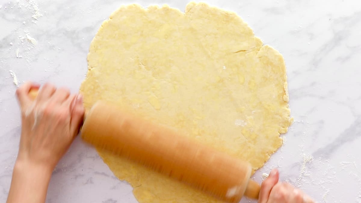 Rolling the dough with a rolling pin
