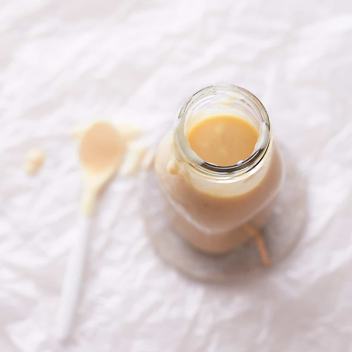 Decorative picture of condensed milk in a glass jar