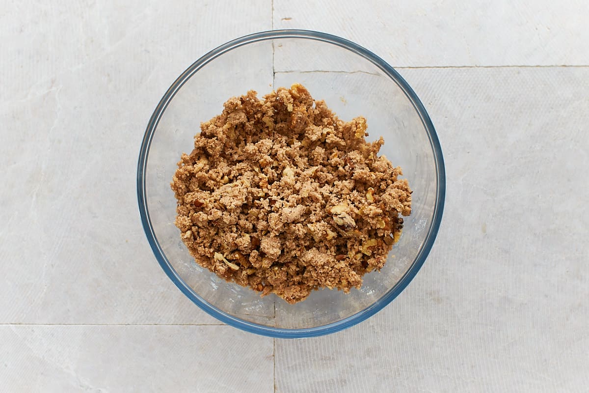 Prepared crumb topping with walnuts in bowl