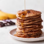 Decorative picture of pancakes with syrup pouring on top