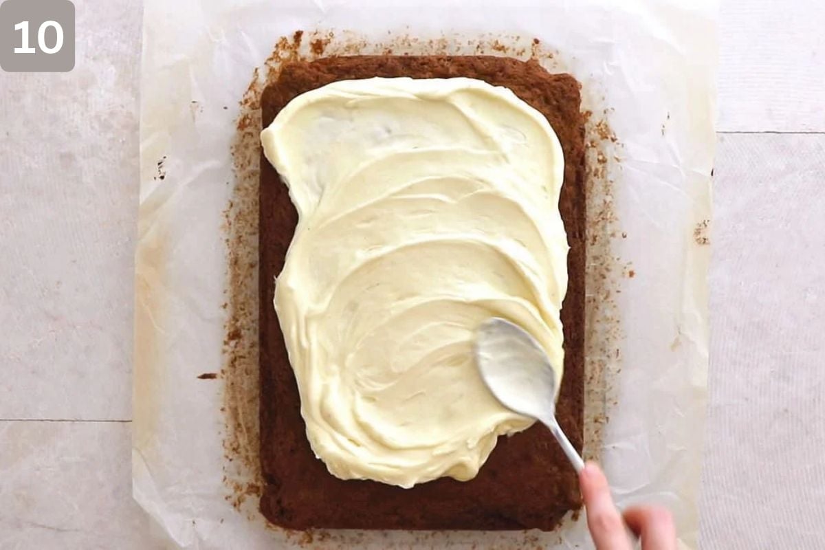 Carrot cake with some frosting spread on top