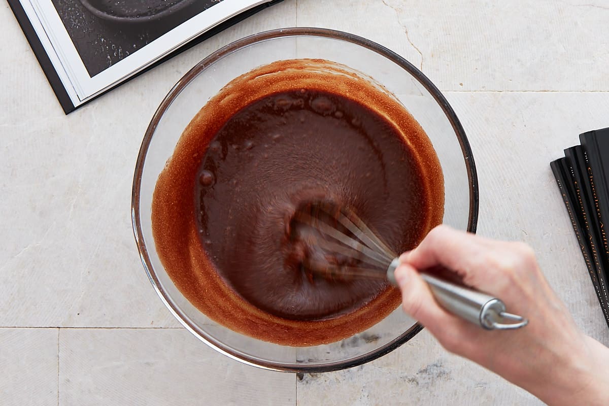 Whisking eggs into the chocolate mixture