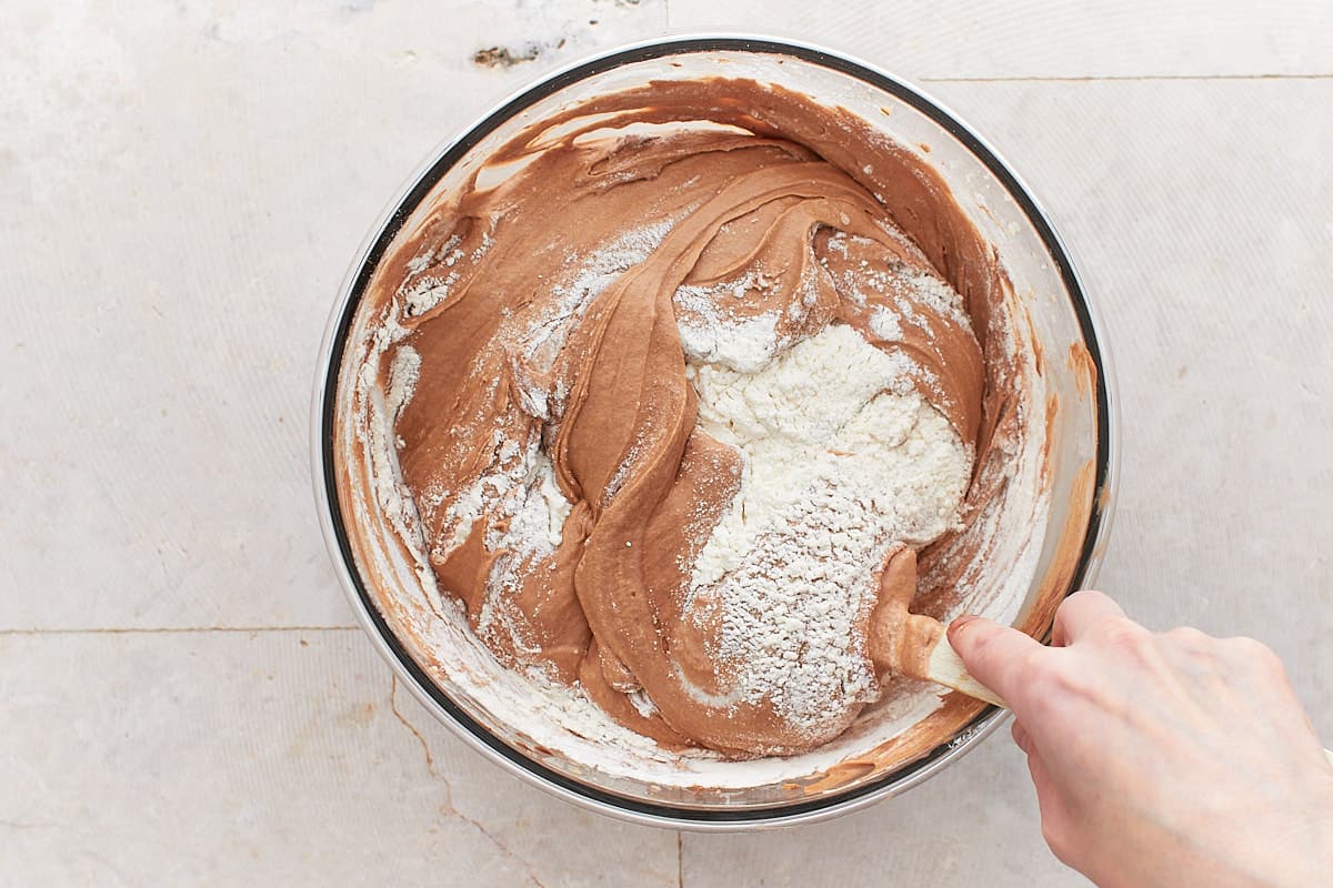 Folding flour into the chocolate batter
