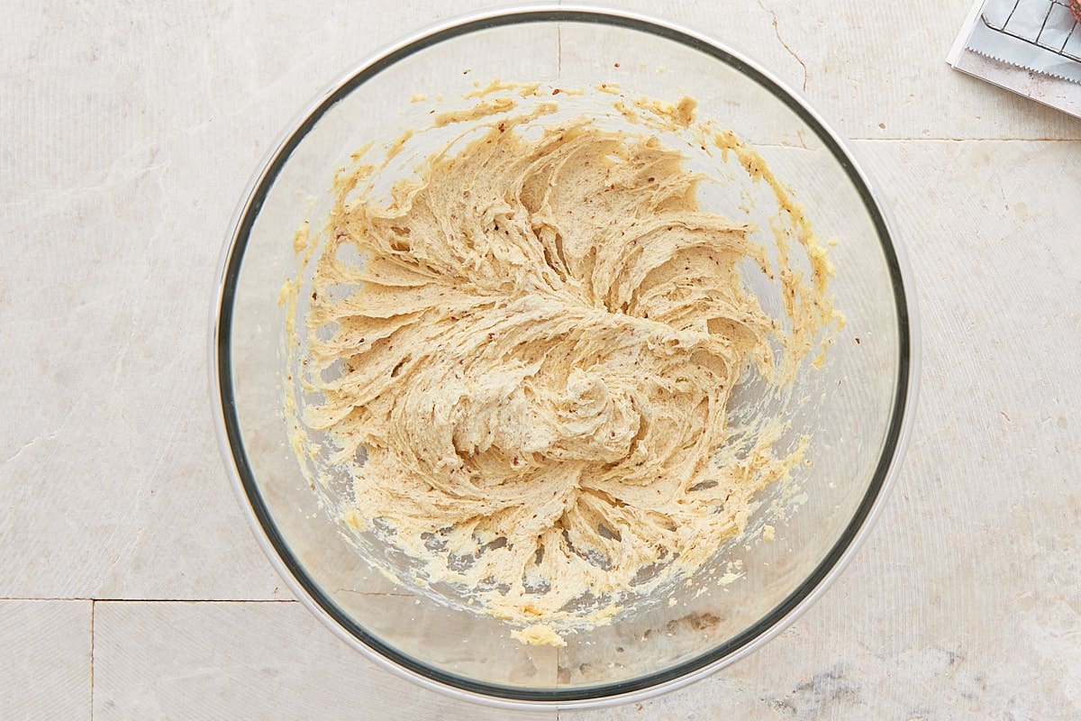 Butter, sugar, and flax egg mixed in a mixing bowl