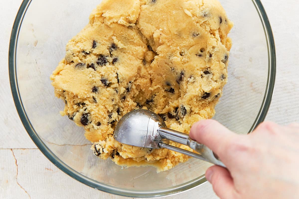 Scooping chilled cookie dough