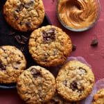 A half dozen cookies on a black plate