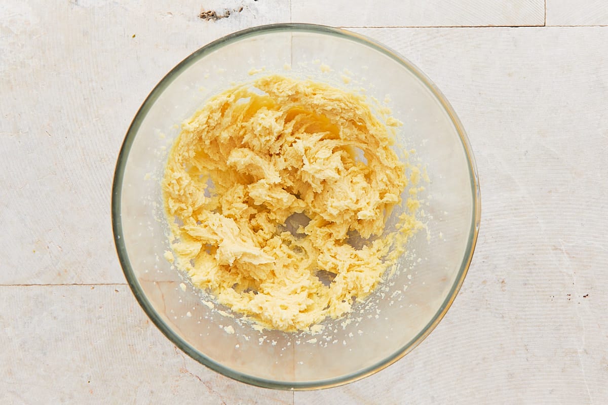Butter, sugar, egg, and vanilla mixed together in a mixing bowl