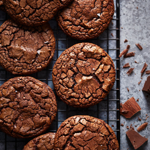 Baked cookies on a black cooling rack