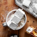 Three marshmallows in a cup of hot chocolate