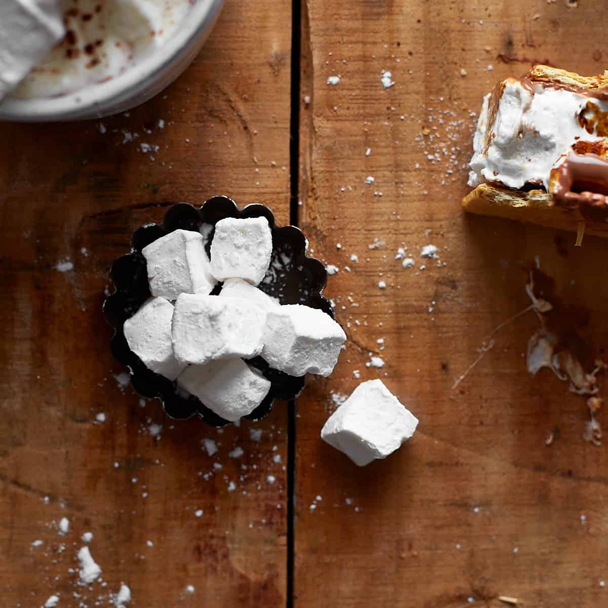 Mini marshmallows on a wooden background