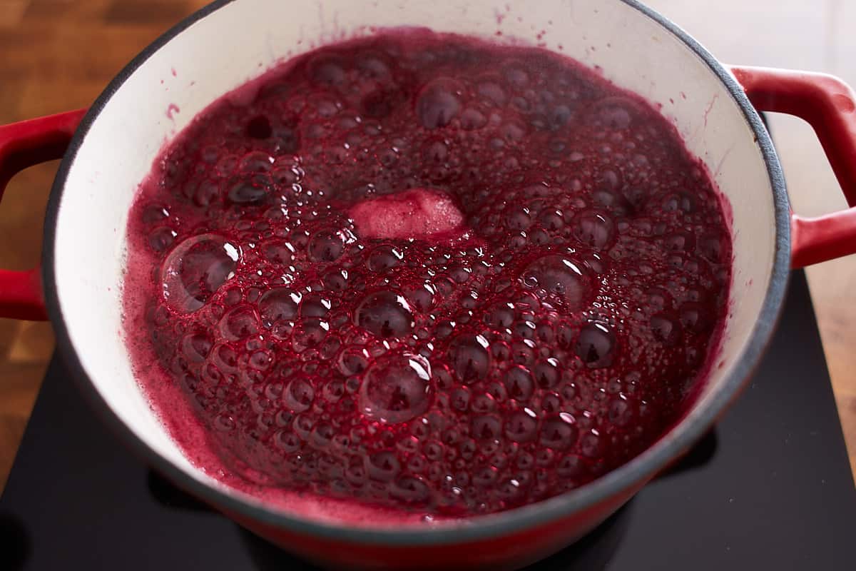 Blueberry sauce cooking in a pot