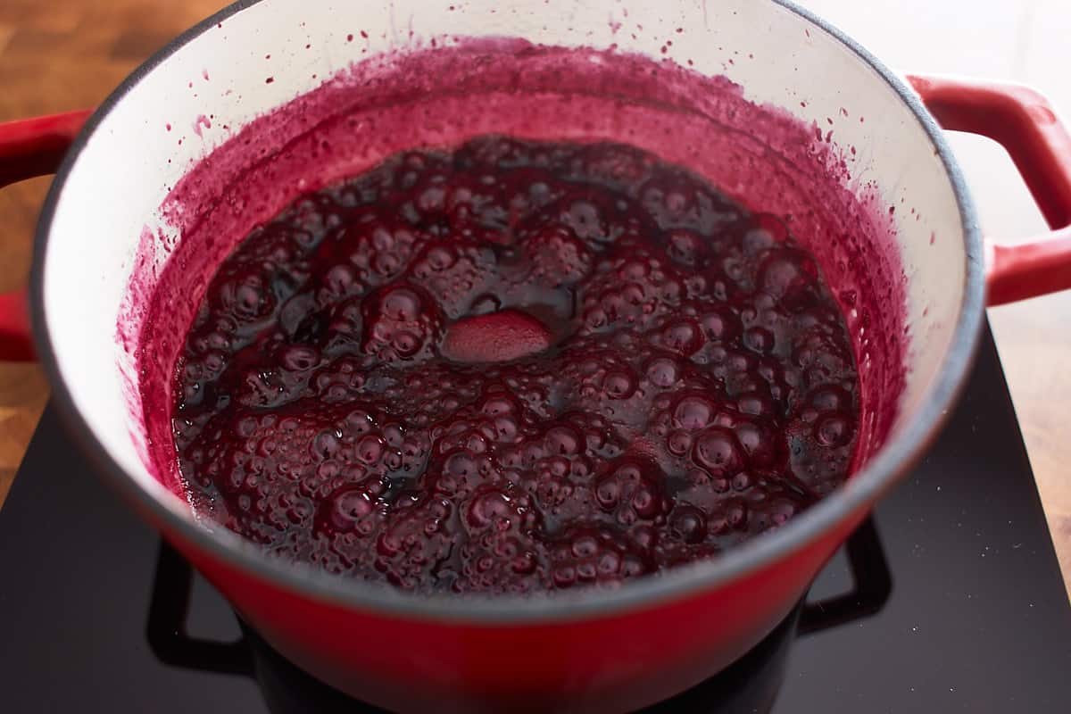 Reduced blueberry sauce cooking in a pot