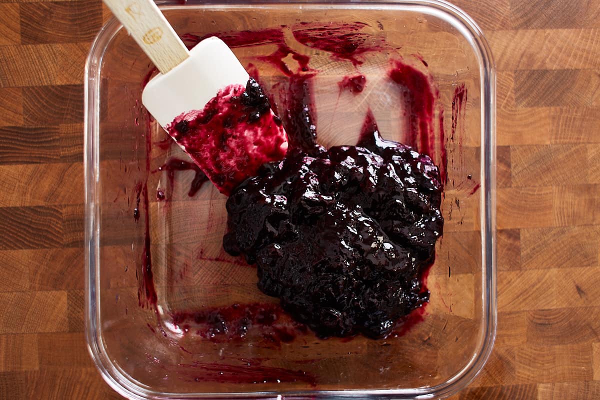 Cooled blueberry sauce in a glass container