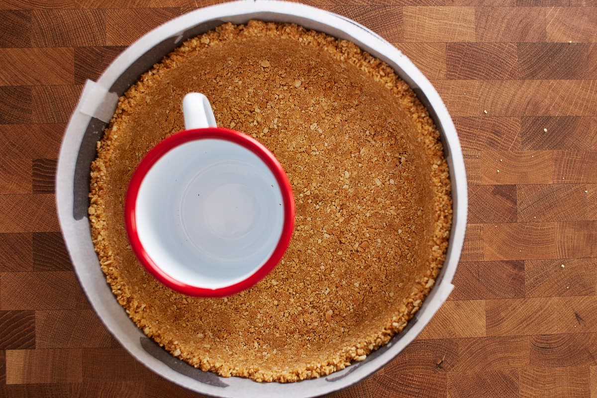 Graham cracker crust pressed into the bottom of a springform pan