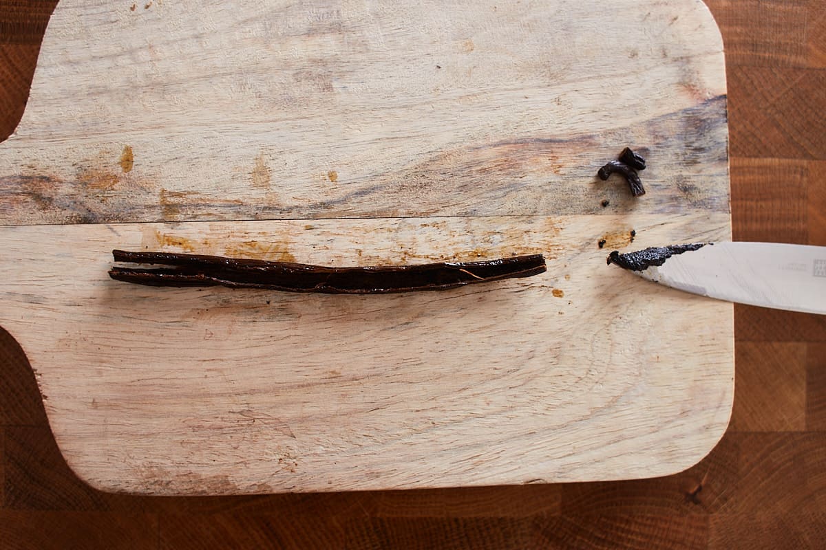 Scraped vanilla bean on a cutting board