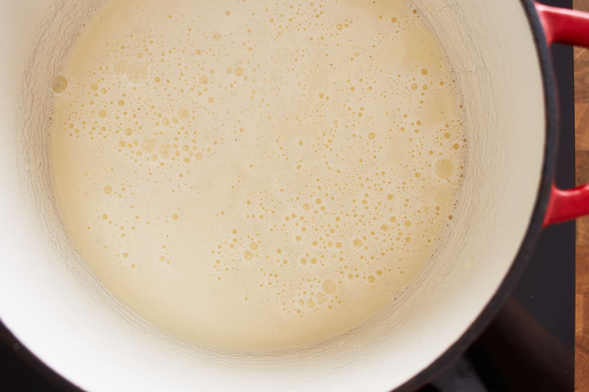 Cream, sugar, and vanilla reaching a boil