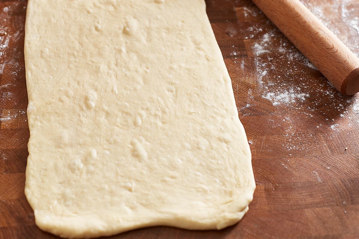 Rolled out dough and a rolling pin