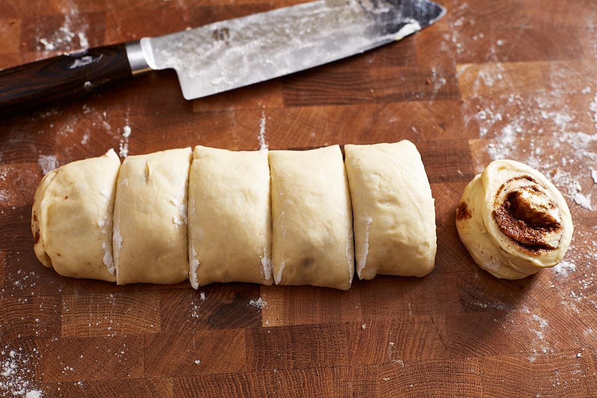 Cut dough roll and a large knife