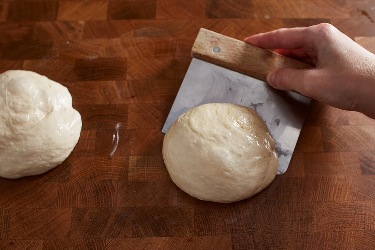 Shaping a piece of dough into a round ball