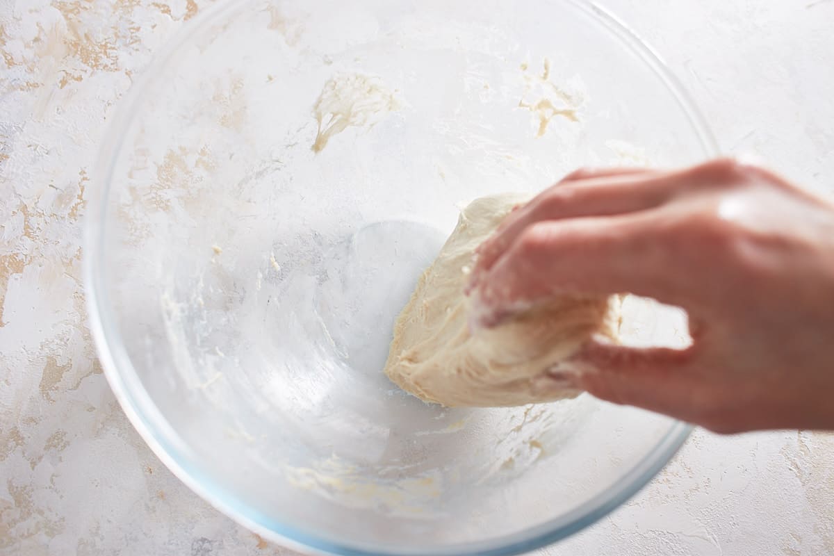 Kneaded dough in a glass bowl