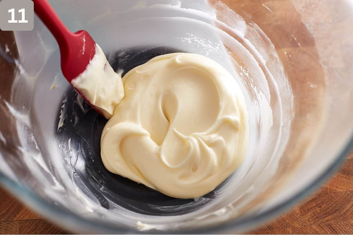 Cream cheese frosting in a glass bowl