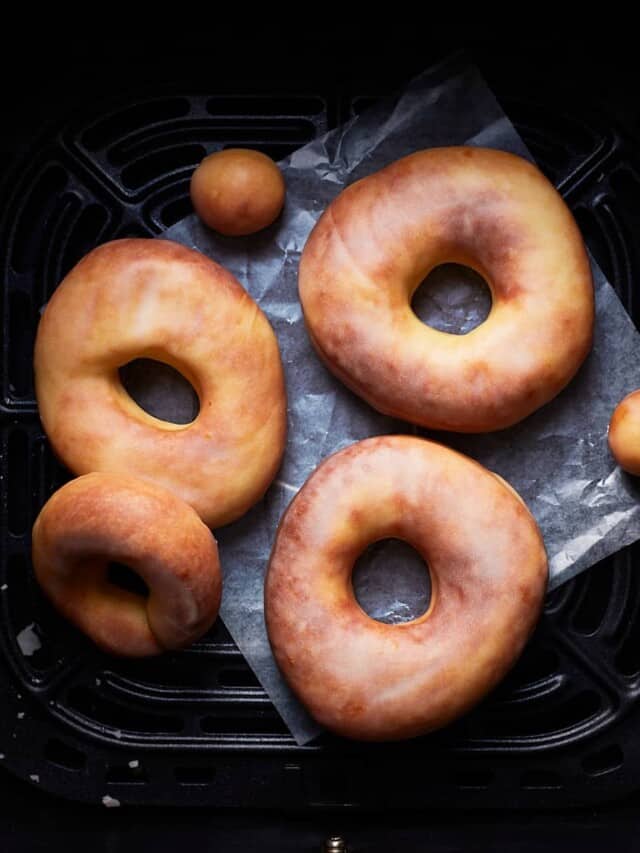 Baked donuts in an air fryer basket