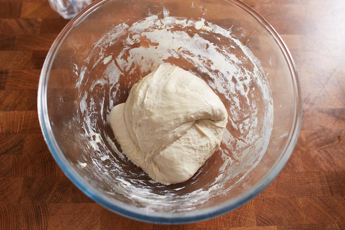 Stretched and folded dough in a mixing bowl