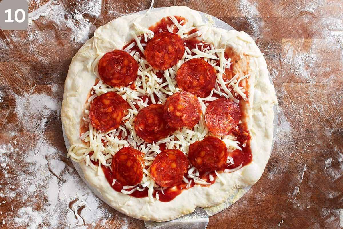 Pizza with toppings before being baked