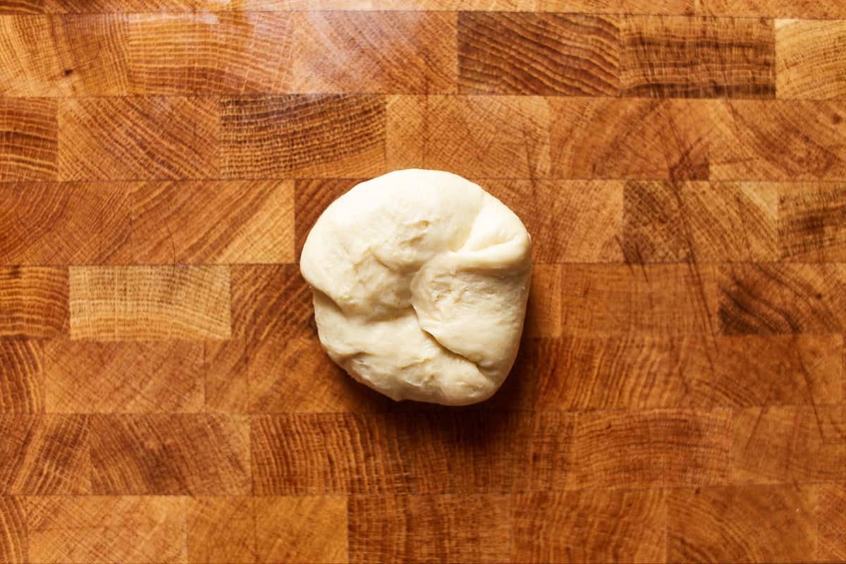 Folded dough piece on a work surface
