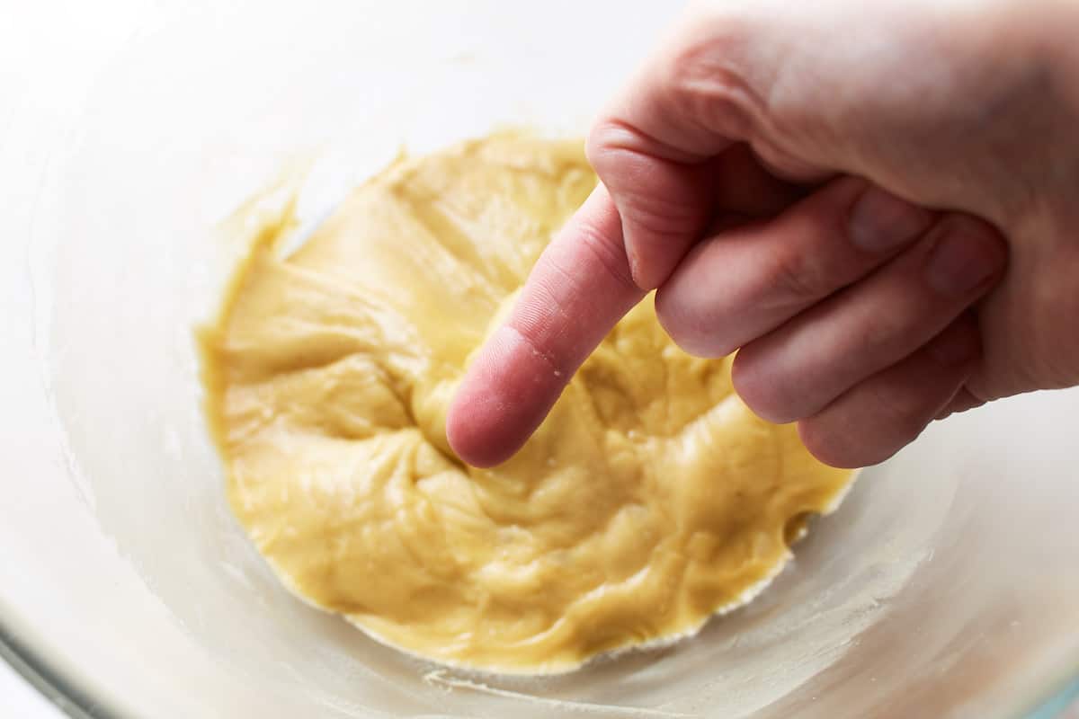 Showing a clean finger that was previously sticked into the dough
