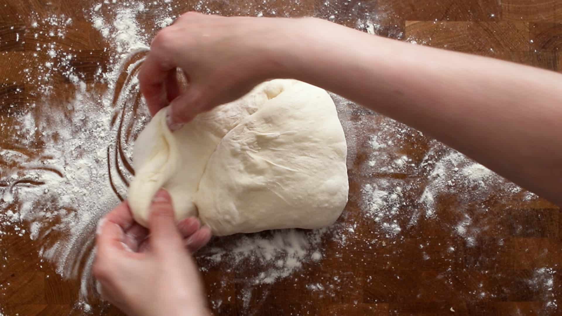 Stretching the left side of the dough