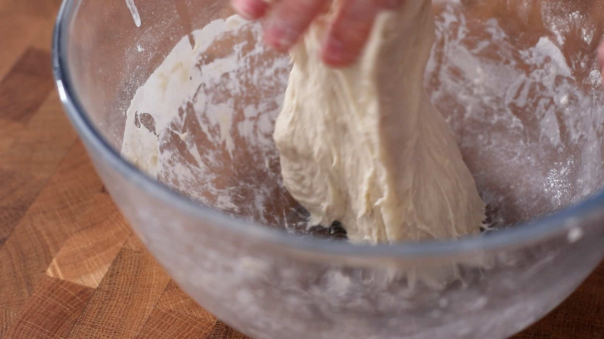 Lifting bread dough out of the bowl